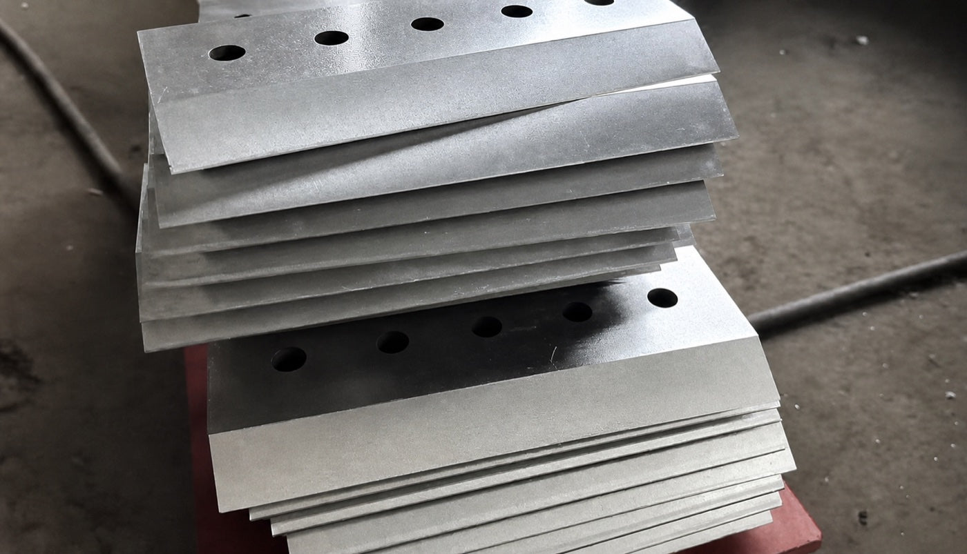 Stacked finished chipper blades